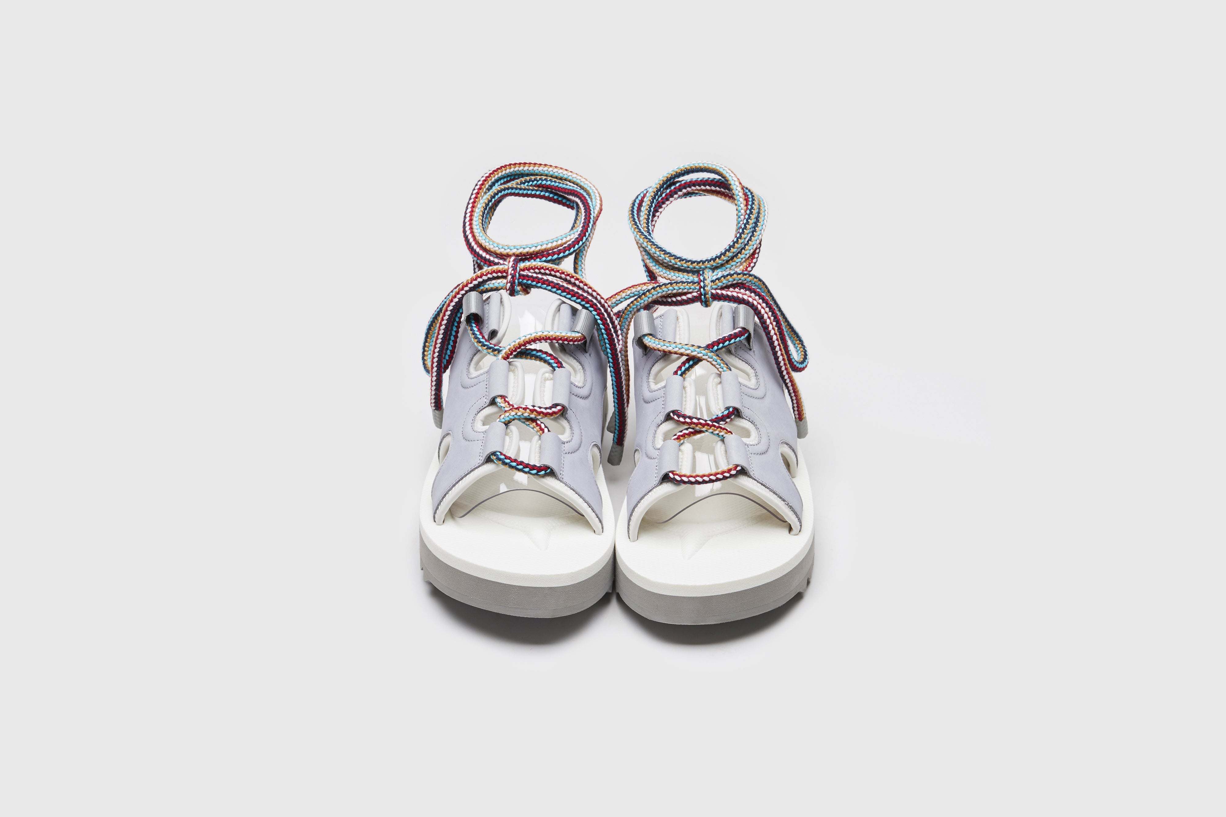 SUICOKE RAY-AB slides with gray x white nylon upper, gray x white midsole and sole, strap and logo patch. From Spring/Summer 2023 collection on eightywingold Web Store, an official partner of SUICOKE. OG-326AB GRAY X WHITE