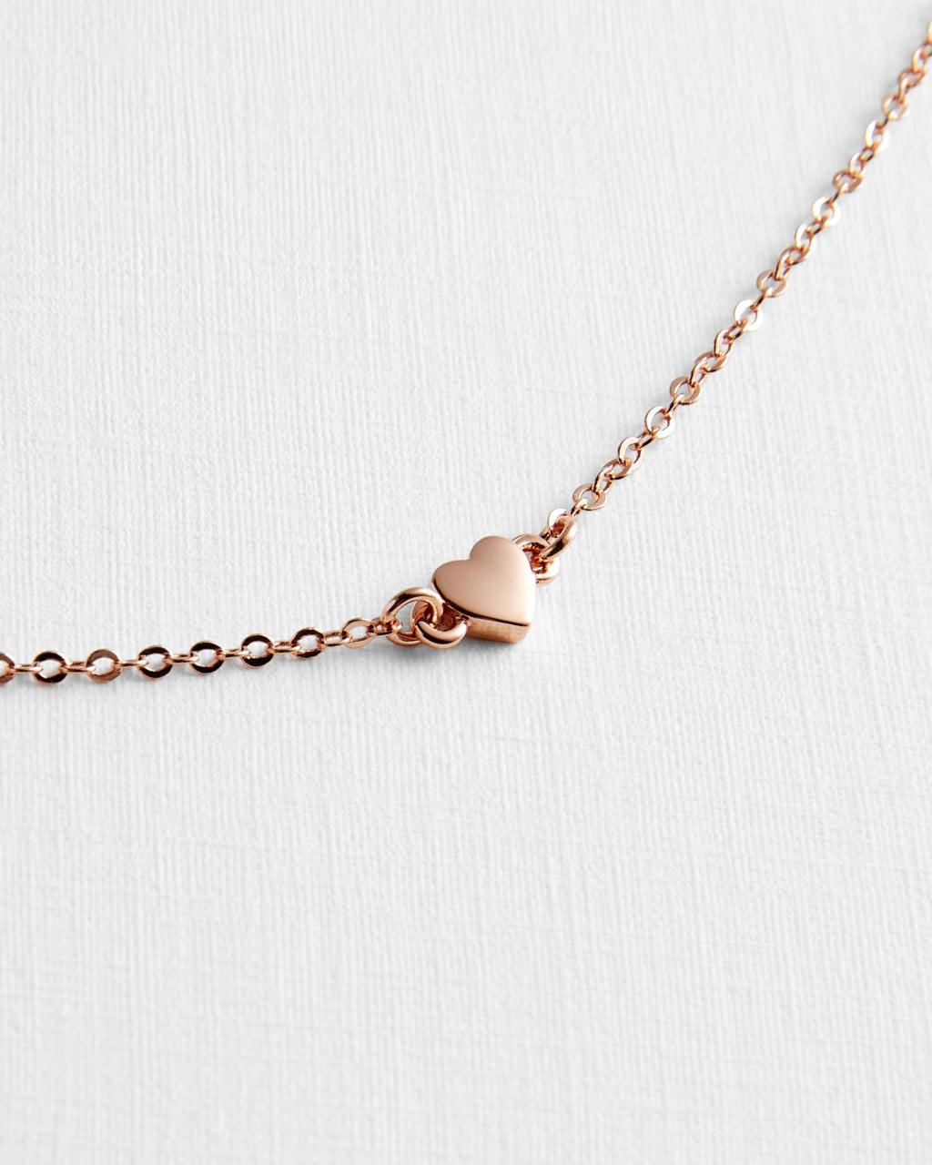 Harsaa Tiny Heart Bracelet in Rose Gold | eightywingold - official partner of Ted Baker