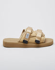 SUICOKE MOTO-Cab slides with beige nylon upper, beige midsole and sole, straps and logo patch. From Spring/Summer 2023 collection on eightywingold Web Store, an official partner of SUICOKE. OG-056CAB BEIGE
