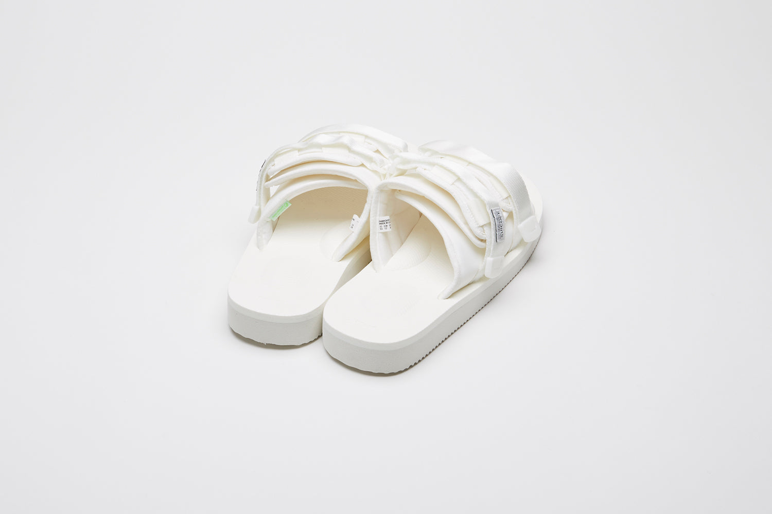 SUICOKE MOTO-Cab slides with white nylon upper, white midsole and sole, straps and logo patch. From Spring/Summer 2023 collection on eightywingold Web Store, an official partner of SUICOKE. OG-056CAB WHITE