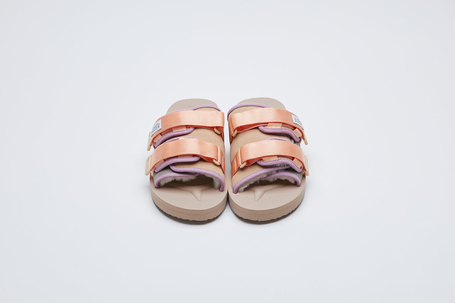 SUICOKE MOTO-Mab suede slides with beige midsole and sole, gray suede upper and shearling inside with light purple piping and light pink nylon straps. From Fall/Winter 2021 collection on SUICOKE Official US & Canada Webstore.