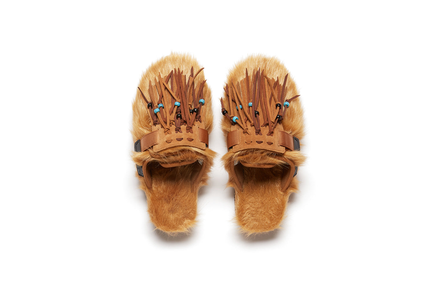 Alanui edition SUICOKE Zavo closed toe slides with camel colored fur on the upper and footbed. Includes a dark and light brown suede-beaded fringe that is a detachable piece from the singular nylon strap across the upper. From Fall/Winter 2021 collection on SUICOKE Official US &amp; Canada Webstore.