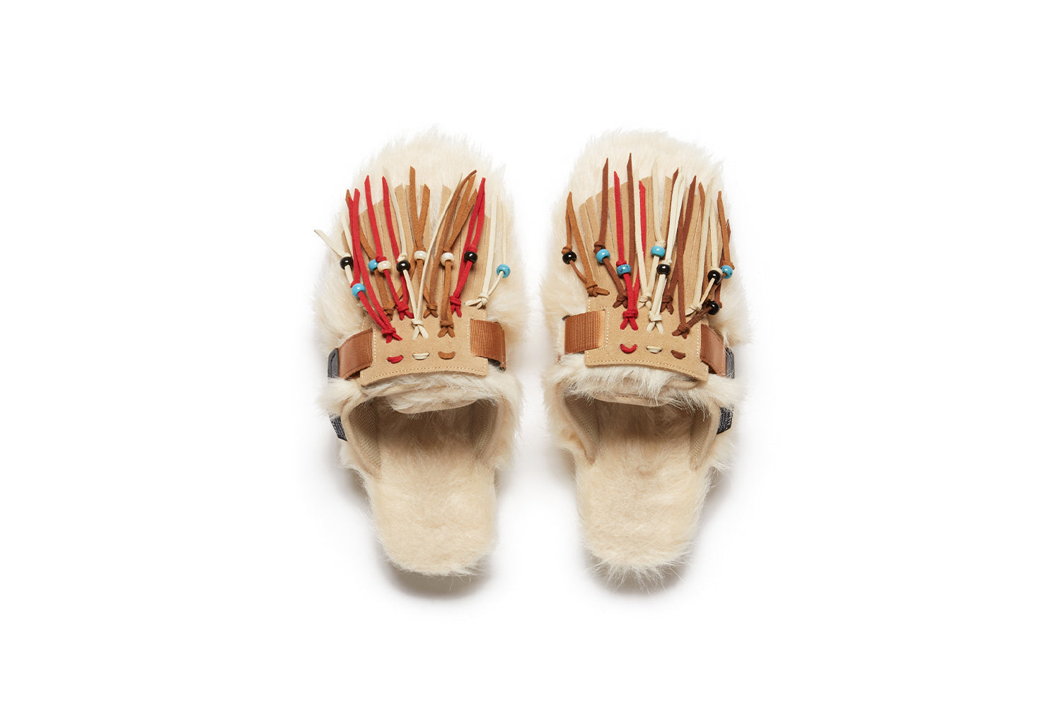 Alanui edition SUICOKE Zavo closed toe slides with ivory colored fur on the upper and footbed. Includes a beige and ivory suede-beaded fringe that is a detachable piece from the singular nylon strap across the upper. From Fall/Winter 2021 collection on SUICOKE Official US & Canada Webstore.