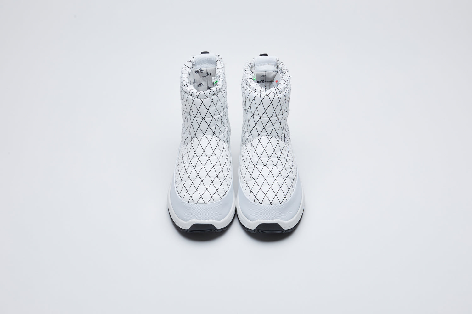 SUICOKE PEPPER-evab-PT1 ankle cut boots with white nylon upper with black outlined diamond print and running sole with adjustable toggle cord closure. From Fall/Winter 2021 collection on SUICOKE Official US &amp; Canada Webstore.