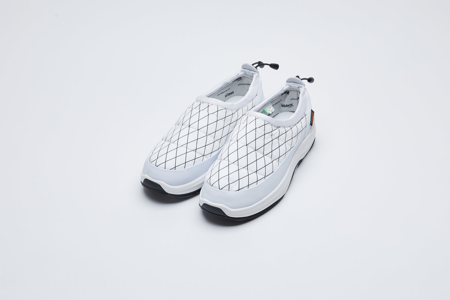 SUICOKE BOWER-evab-PT1 low top ankle boots with white nylon upper with black outlined diamond print and a running sole with adjustable toggle cord closure. From Fall/Winter 2021 collection on SUICOKE Official US &amp; Canada Webstore.