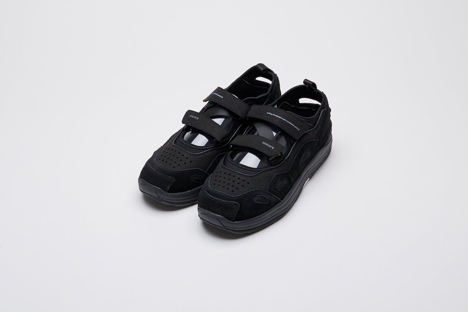 SUICOKE AKK-ab shoes with black cow suede and nylon upper, black midsole and sole, straps and logo patch. From Spring/Summer 2022 collection on SUICOKE Official US &amp; Canada Webstore.