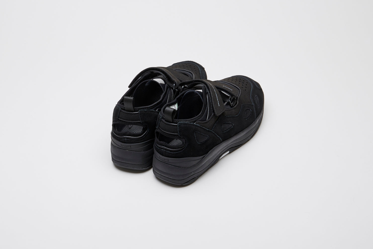 SUICOKE AKK-ab shoes with black cow suede and nylon upper, black midsole and sole, straps and logo patch. From Spring/Summer 2022 collection on SUICOKE Official US &amp; Canada Webstore.