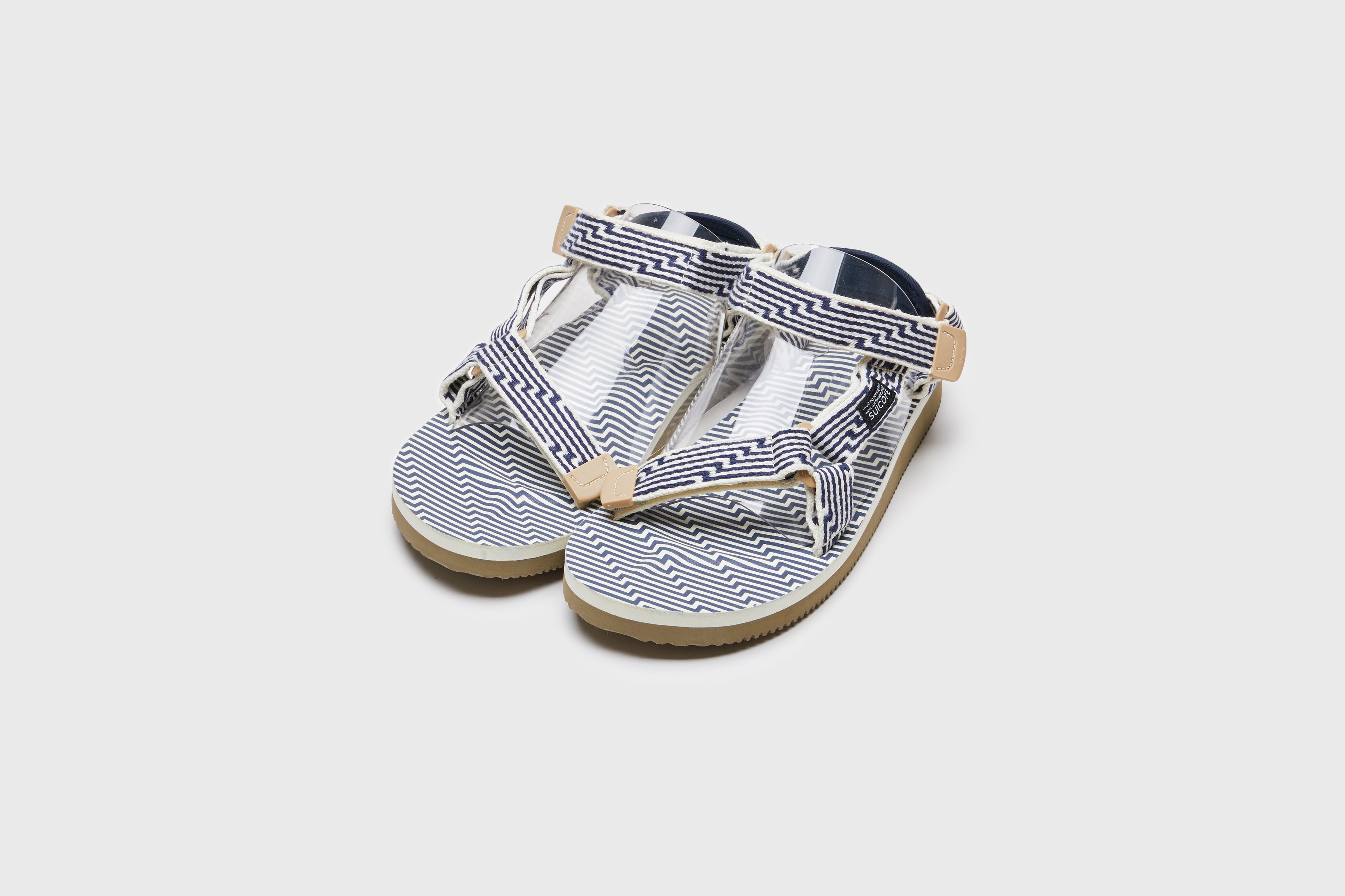 SUICOKE DEPA-JC01 sandals with ivory & navy nylon upper, ivory & navy midsole and sole, strap and logo patch. From Spring/Summer 2023 collection on eightywingold Web Store, an official partner of SUICOKE. OG-022-JC01 IVORY X NAVY