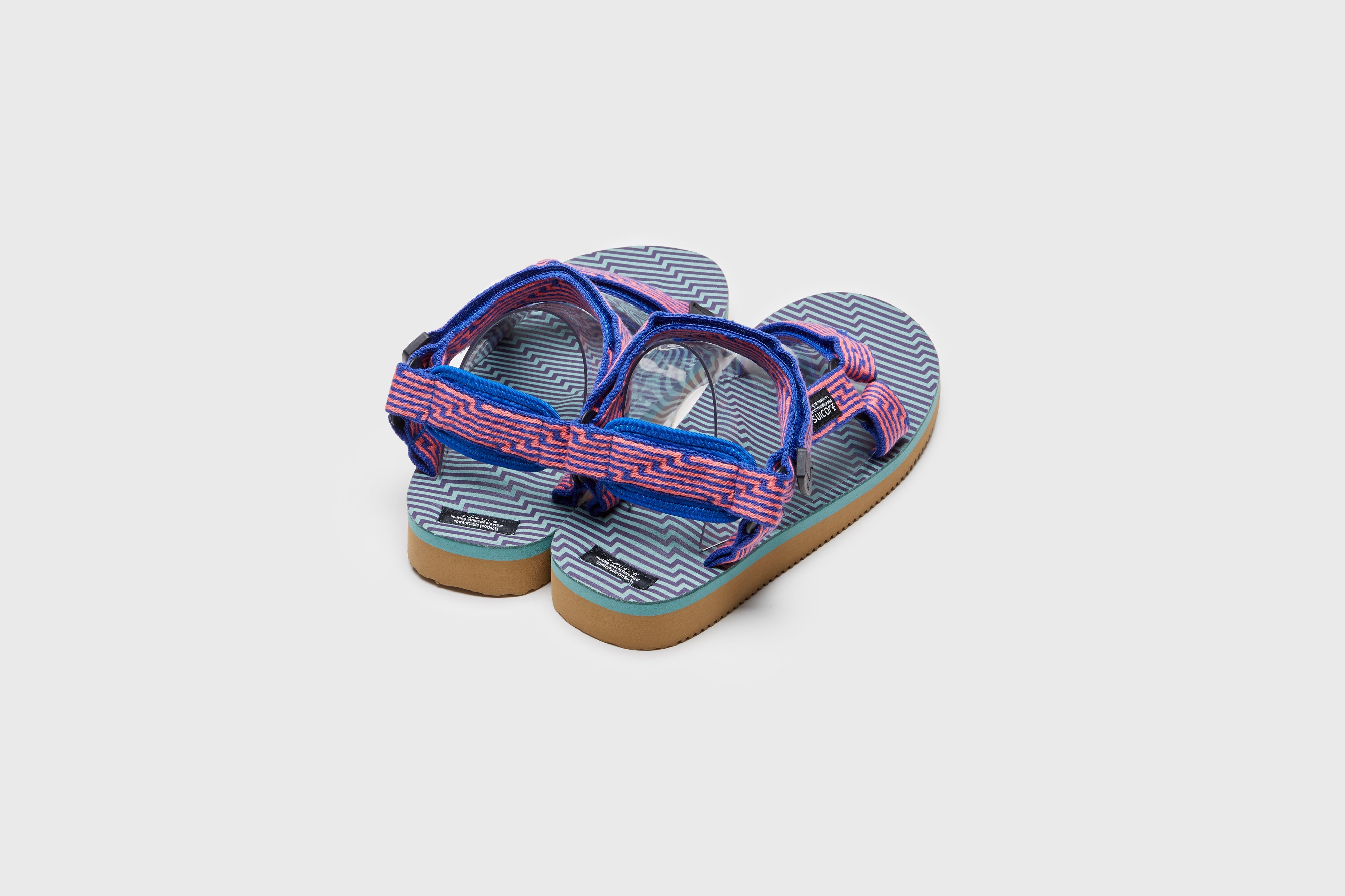 SUICOKE DEPA-JC01 sandals with orange & blue nylon upper, orange & blue midsole and sole, strap and logo patch. From Spring/Summer 2023 collection on eightywingold Web Store, an official partner of SUICOKE. OG-022-JC01 ORANGE X BLUE