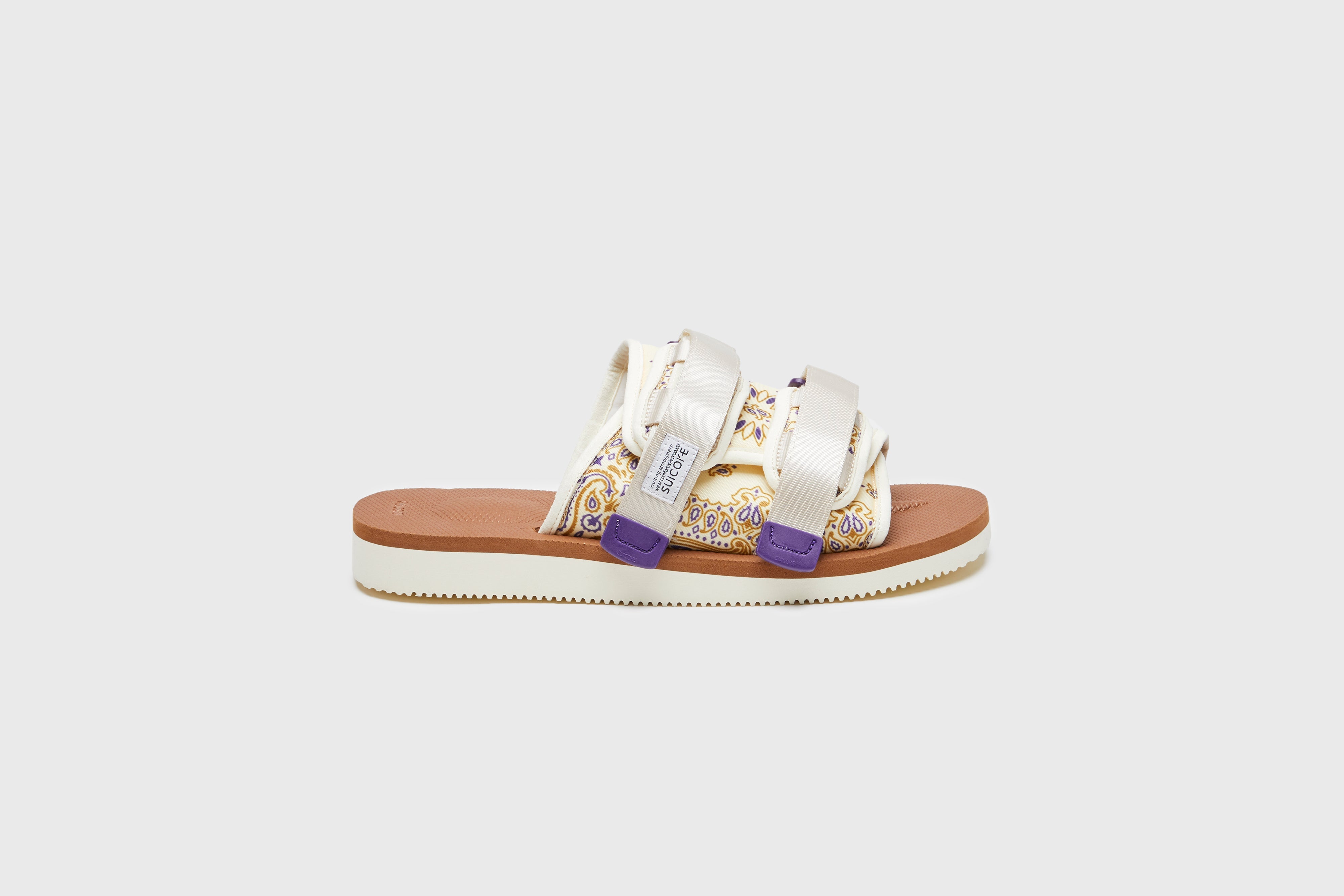 SUICOKE MOTO-Cab-PT05 sandals with ivory & brown nylon upper, ivory & brown midsole and sole, strap and logo patch. From Spring/Summer 2023 collection on eightywingold Web Store, an official partner of SUICOKE. OG-056CAB-PT05 IVORY X BROWN