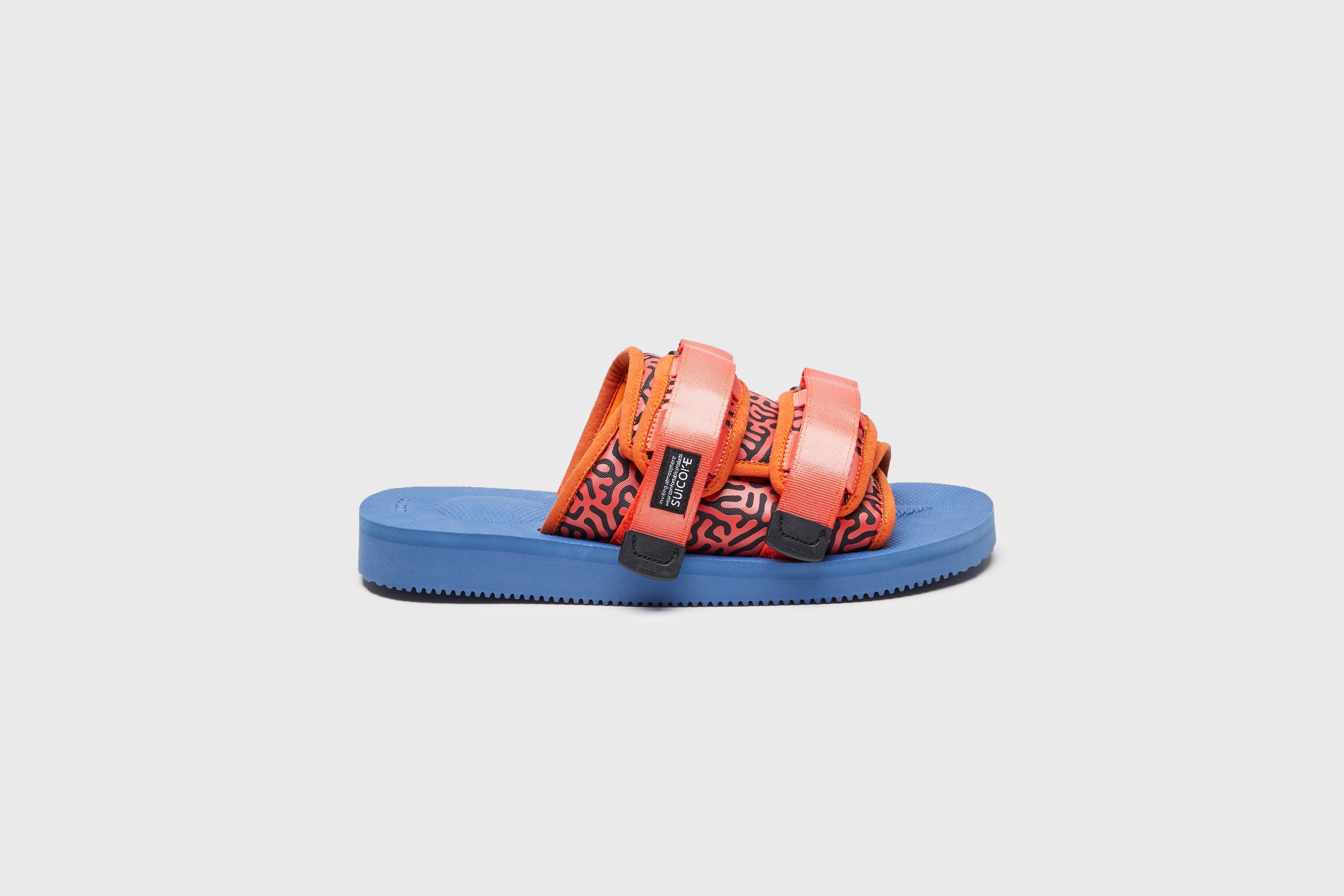 SUICOKE MOTO-Cab-PT06 slides with orange &amp; navy nylon upper, orange &amp; navy midsole and sole, strap and logo patch. From Spring/Summer 2023 collection on eightywingold Web Store, an official partner of SUICOKE. OG-056CAB-PT06 ORANGE X NAVY