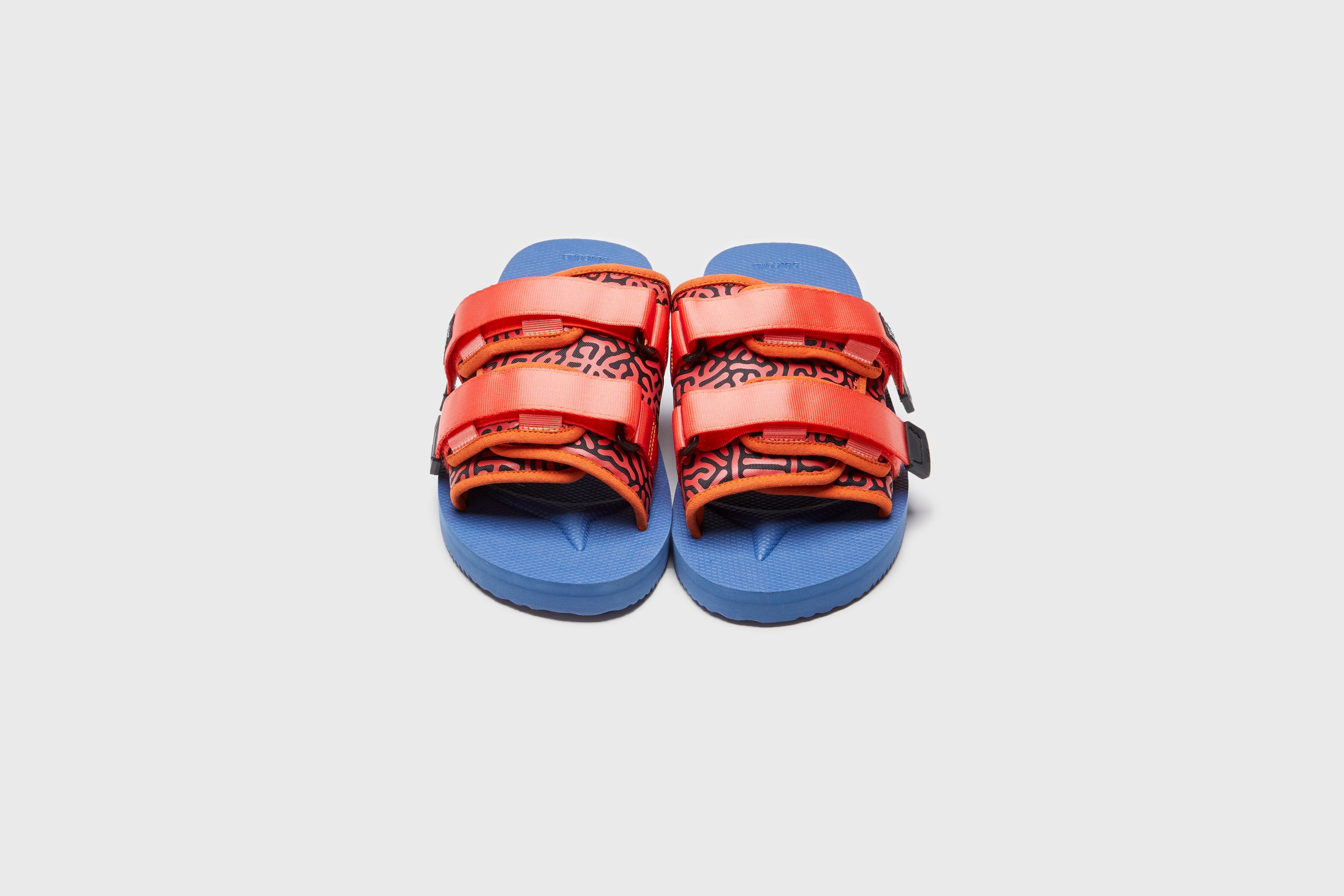 SUICOKE MOTO-Cab-PT06 slides with orange & navy nylon upper, orange & navy midsole and sole, strap and logo patch. From Spring/Summer 2023 collection on eightywingold Web Store, an official partner of SUICOKE. OG-056CAB-PT06 ORANGE X NAVY