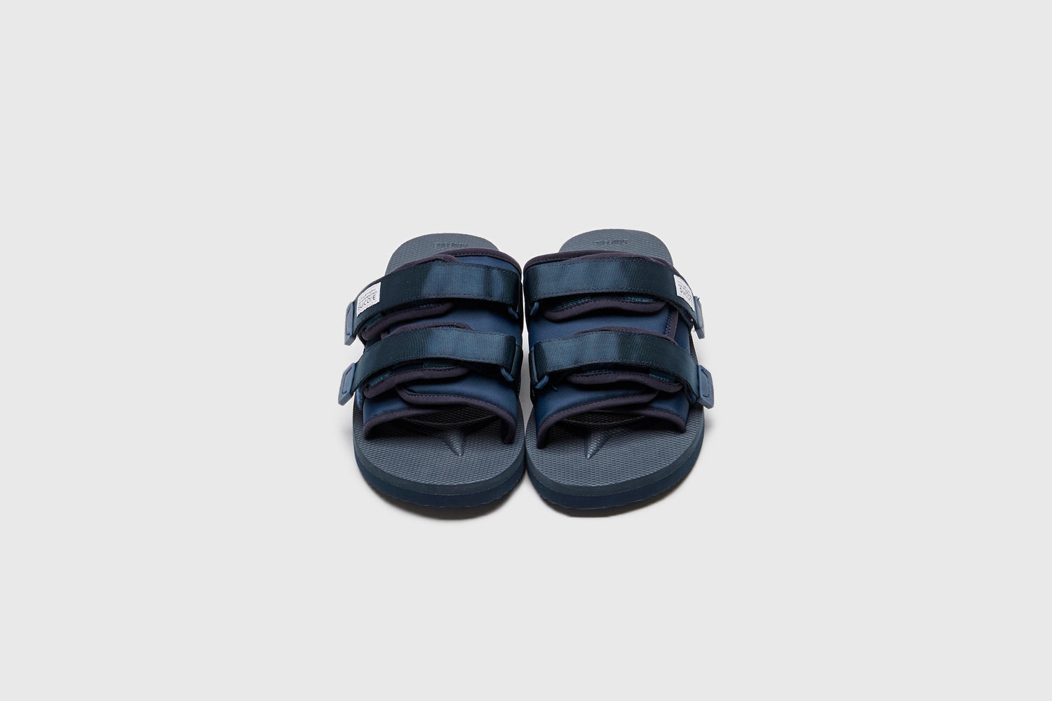 SUICOKE MOTO-Cab slides with navy nylon upper, navy midsole and sole, straps and logo patch. From Spring/Summer 2023 collection on eightywingold Web Store, an official partner of SUICOKE. OG-056CAB NAVY