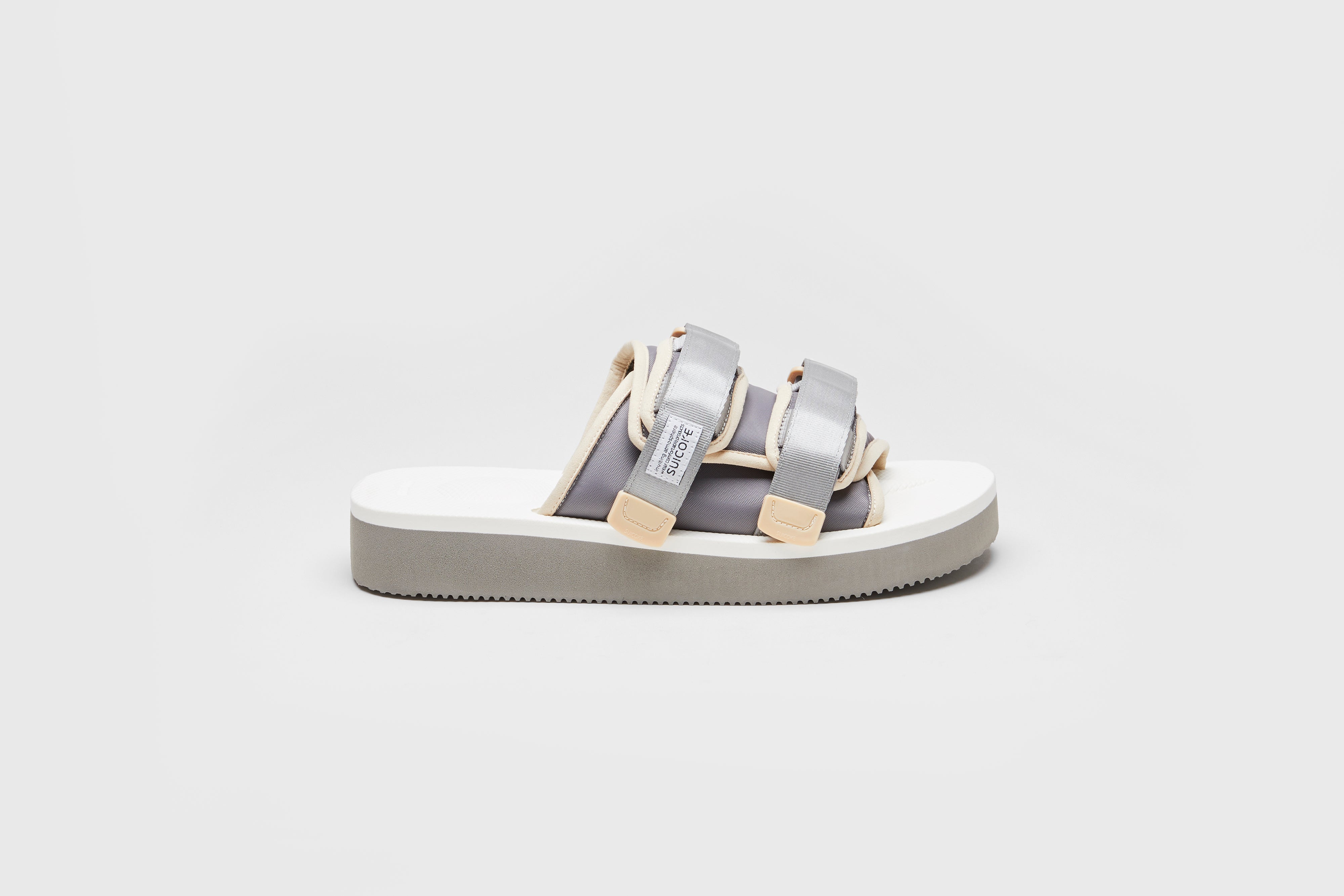 SUICOKE MOTO-PO slides with gray & white nylon upper, gray & white midsole and sole, strap and logo patch. From Spring/Summer 2023 collection on eightywingold Web Store, an official partner of SUICOKE. OG-056PO GRAY X WHITE