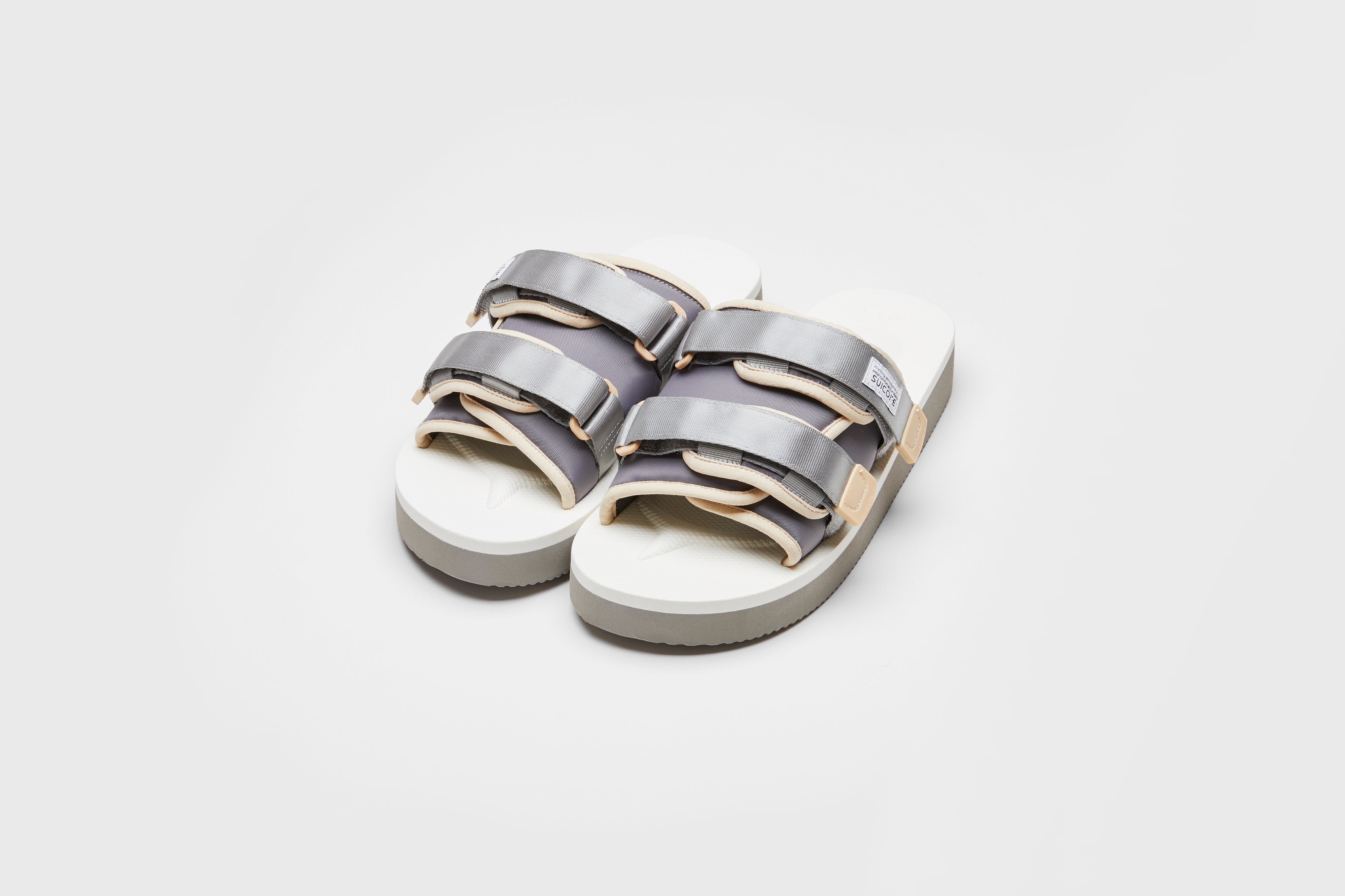 SUICOKE MOTO-PO slides with gray &amp; white nylon upper, gray &amp; white midsole and sole, strap and logo patch. From Spring/Summer 2023 collection on eightywingold Web Store, an official partner of SUICOKE. OG-056PO GRAY X WHITE