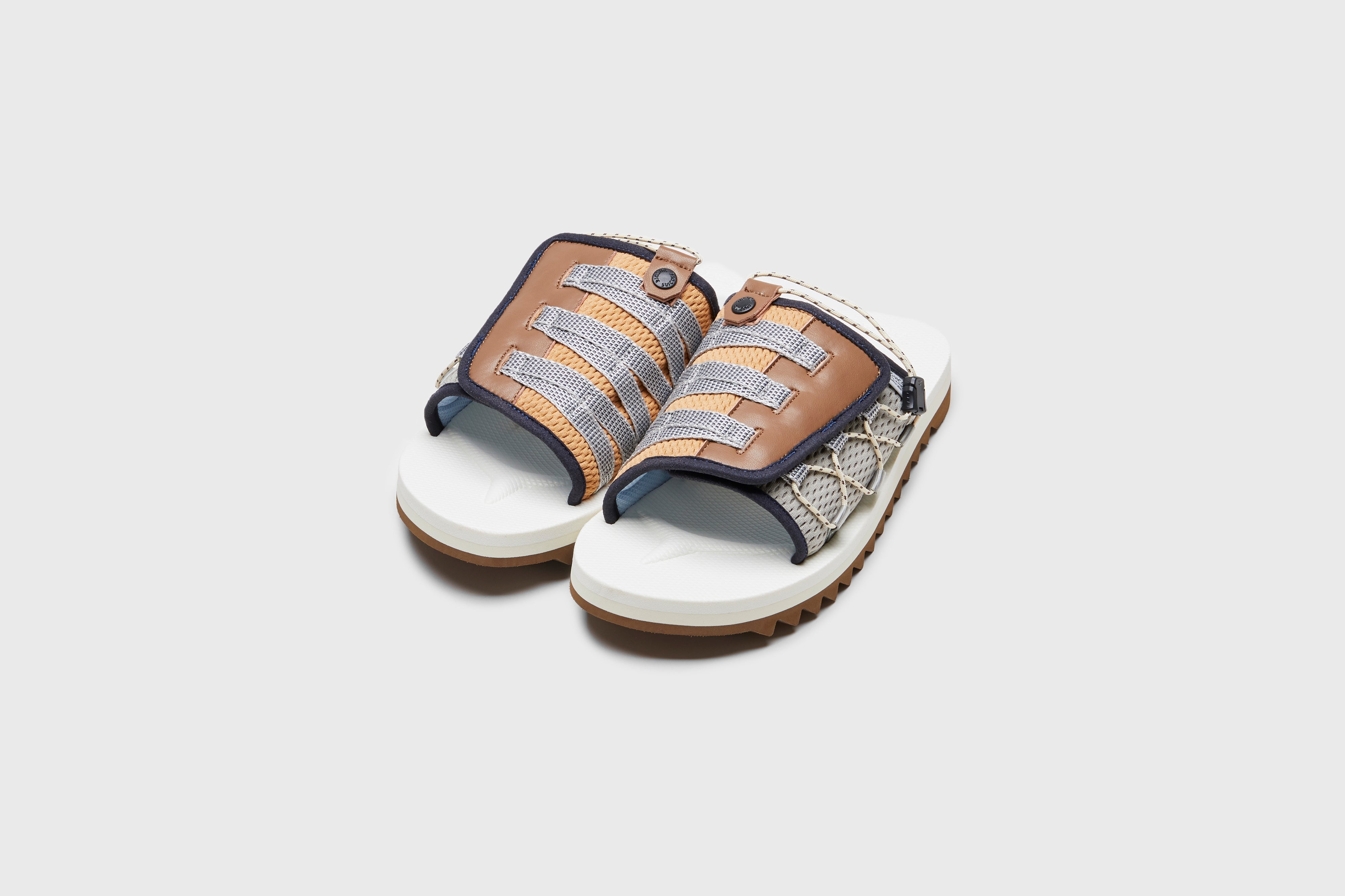SUICOKE DAO-2AB slides with navy &amp; white nylon upper, navy &amp; white midsole and sole, strap and logo patch. From Spring/Summer 2023 collection on eightywingold Web Store, an official partner of SUICOKE. OG-195-2AB NAVY X WHITE