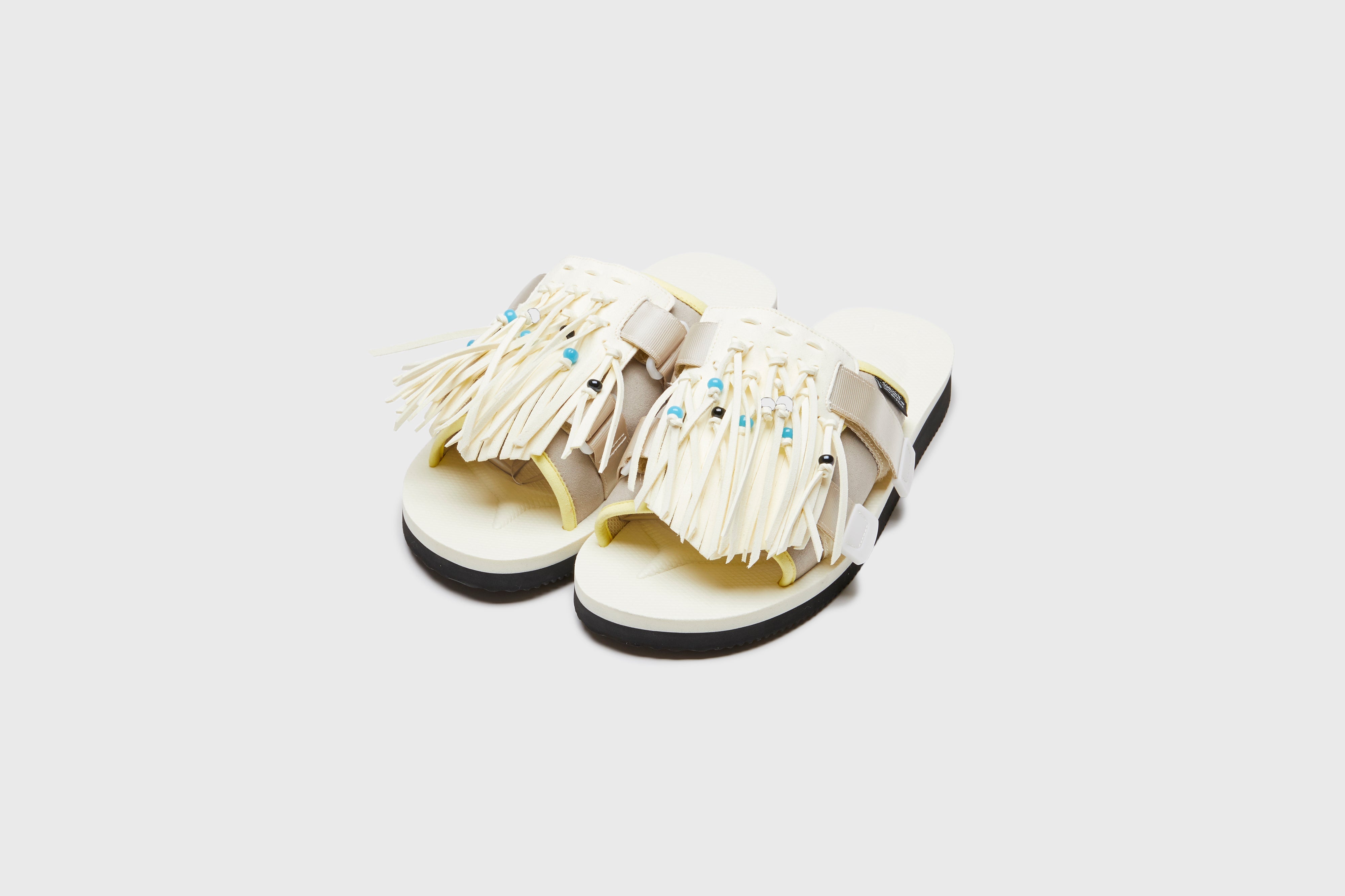 SUICOKE HOTO-Cab slides with ivory nylon upper, ivory midsole and sole, strap and logo patch. From Spring/Summer 2023 collection on eightywingold Web Store, an official partner of SUICOKE. OG-247CAB IVORY