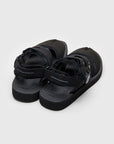 SUICOKE HAKU-ab slides with black nylon upper, black midsole and sole, strap and logo patch. From Spring/Summer 2023 collection on eightywingold Web Store, an official partner of SUICOKE. OG-257AB BLACK