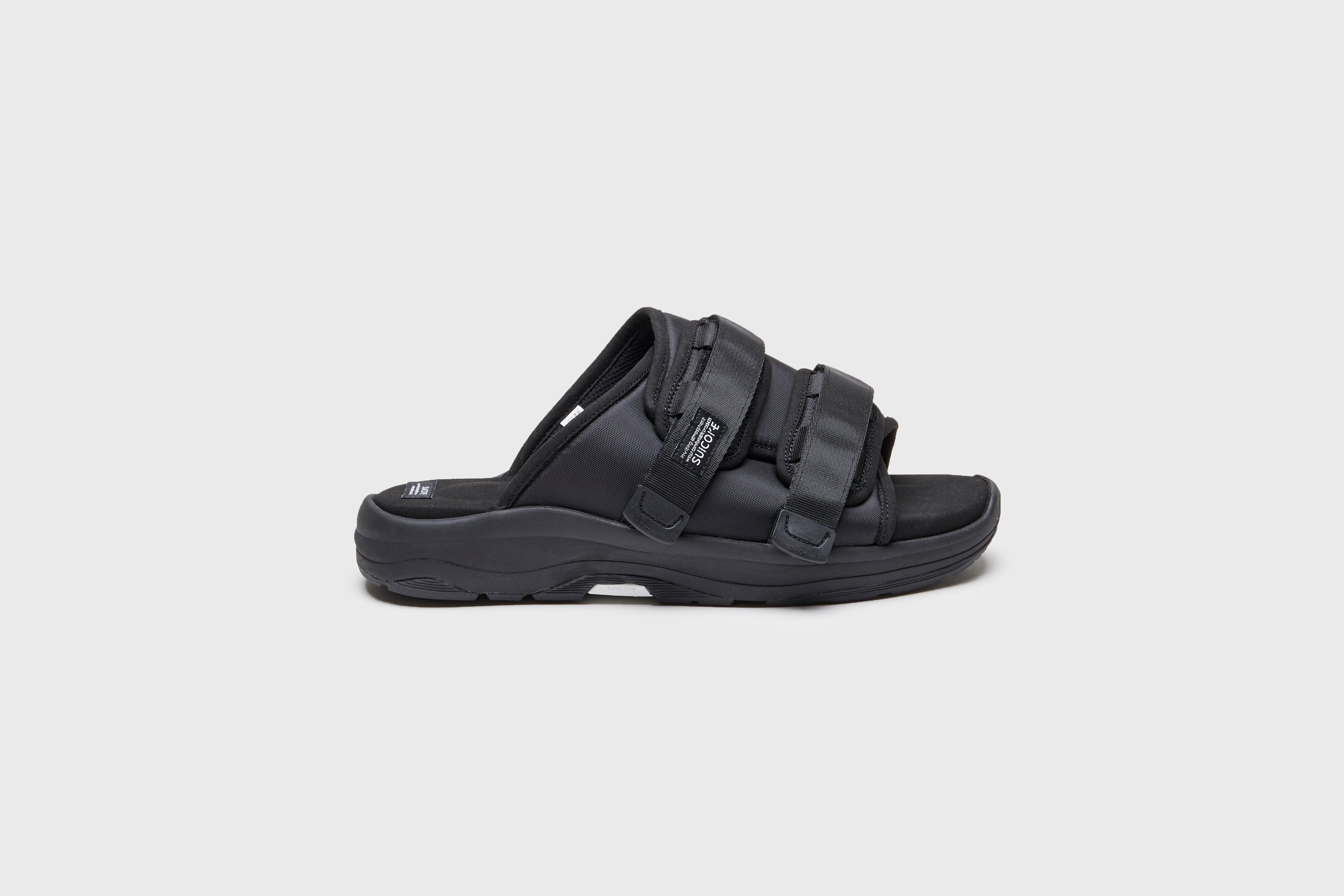 SUICOKE MOTO-Run slides with black nylon upper, black midsole and sole, strap and logo patch. From Spring/Summer 2023 collection on eightywingold Web Store, an official partner of SUICOKE. OG-332 BLACK