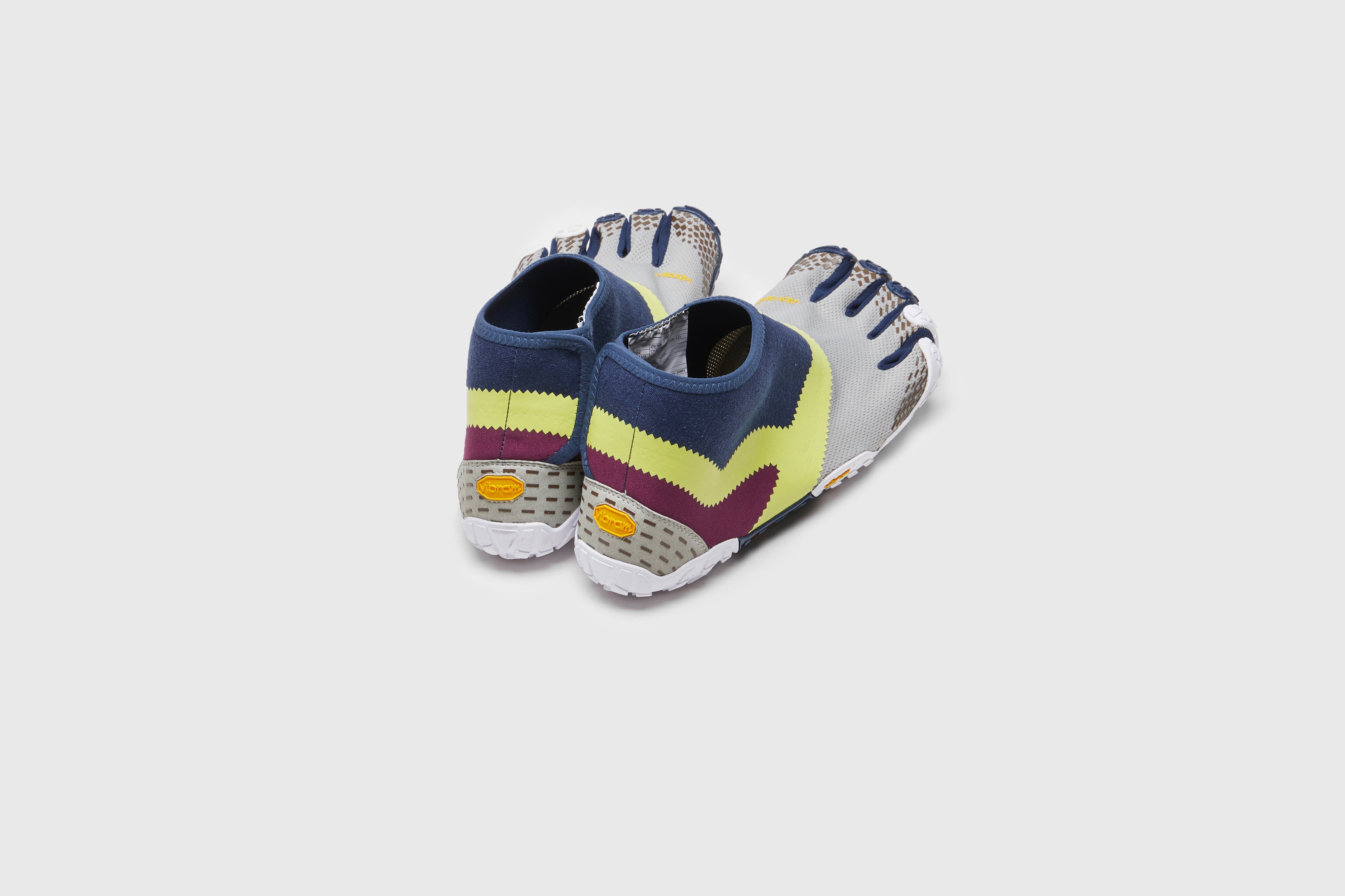 SUICOKE NIN-LO sneakers with navy &amp; yellow nylon upper, navy &amp; yellow midsole and sole, and logo patch. From Spring/Summer 2023 collection on eightywingold Web Store, an official partner of SUICOKE.  S23MLC1 NAVY X YELLOW