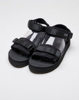 SUICOKE CEL-PO sandals with black nylon upper, black midsole and sole, strap and logo patch. From Spring/Summer 2023 collection on eightywingold Web Store, an official partner of SUICOKE. OG-64PO BLACK